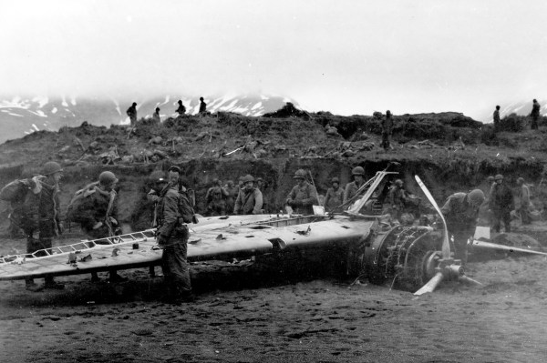 Soldiers of the 7th Infantry Division examine a wrecked Nakajima "Rufe" float plane fighter captured on Attu.
