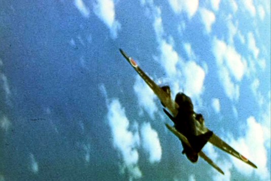A late-war G4M Betty bomber about to be short down by a VF-17 Hellcat during a raid on the U.S. fast carrier fleet. This one is carrying an Ohka piloted rocket bomb under its fuselage. The Betty was used throughout the war by the Imperial Japanese Naval Air Force.