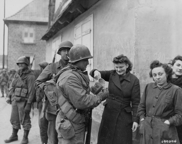 79th inf div 314th inf regt troops get wine from french civilian women Drusenheim France 010645  (1 of 1)
